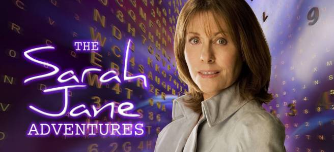 A picture of Sarah Jane Smith (Elisabeth Sladen), surrounded by a vortex of purple/gold letters and numbers. She's got brown hair, is wearing a cream coloured coat, and smiling. To her left, in luminous purple, it reads: The Sarah Jane Adventures